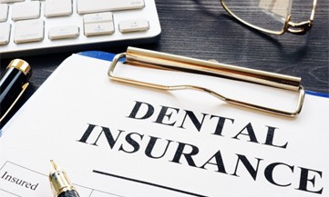 Close-up of a dental insurance form on a clipboard