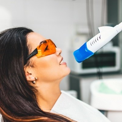 Dental patient receiving teeth whitening treatment