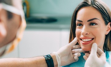 patient smiling after dental crowns in Chesapeake
