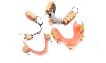 Implant dentures on a plastic base