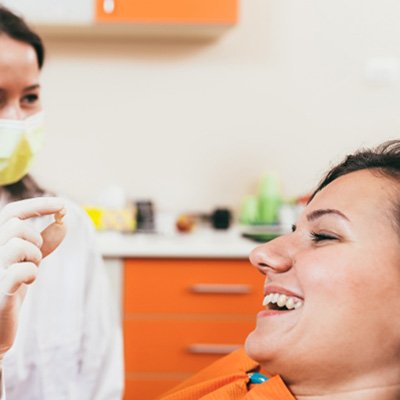 A patient talking to a dentist after a tooth extraction