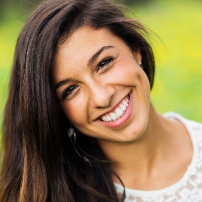 Woman sharing flawless smile after gum recontouring