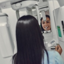 Woman receiving 3 D C T digital scan to plan for CEREC dental crowns