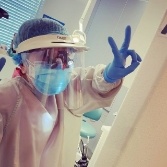 Dentist in Chesapeake giving peace sign