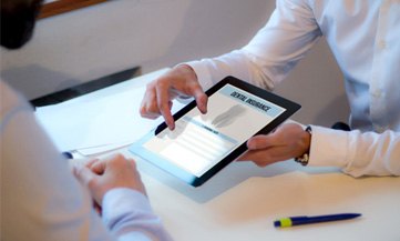 Showing patient dental insurance form on tablet