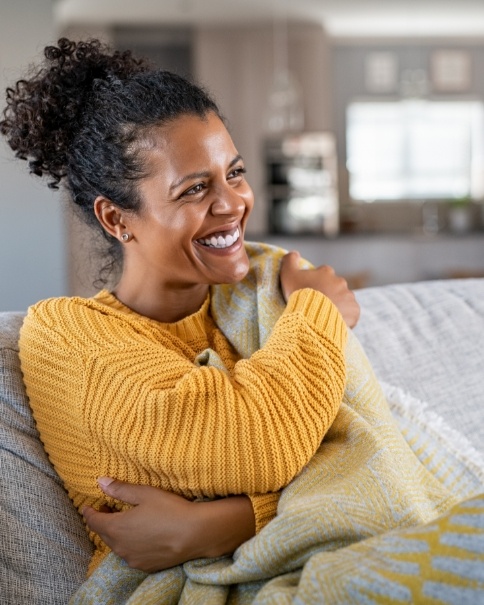 Woman with dental membership plan smiling