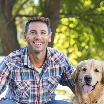 Man sharing healthy smile and enjoying the benefits of metal free dental restorations