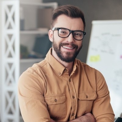 Man enjoying new smile after Invisalign treatment