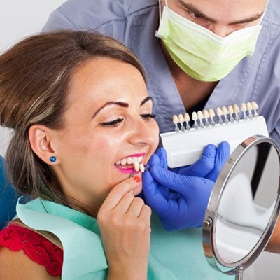 woman trying on veneers in Chesapeake 