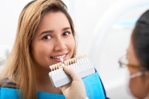 young woman getting instant orthodontics in Chesapeake with veneers 