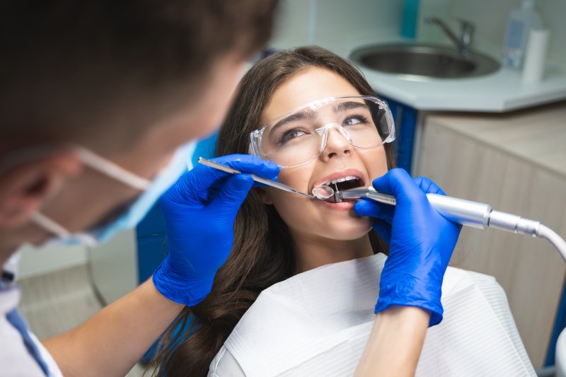 A woman undergoing a root canal