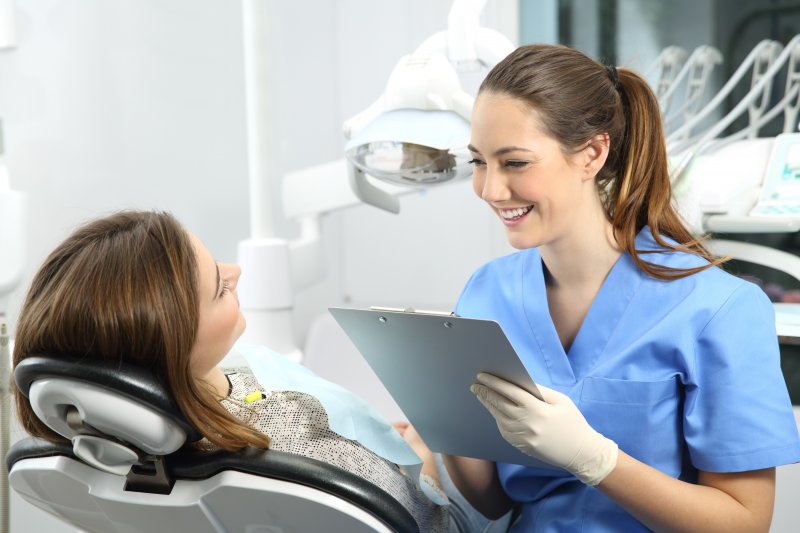 patient at dentist preparing to replace metal fillings